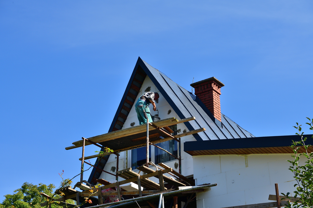 Energy saving by insulating the roof house with white polystyrene