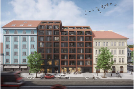 Vizualizácia bytového domu Iconik v Prahe ukazuje modernú architektúru s industriálnymi prvkami, ktorá harmonicky zapadá do historického prostredia Karlína.