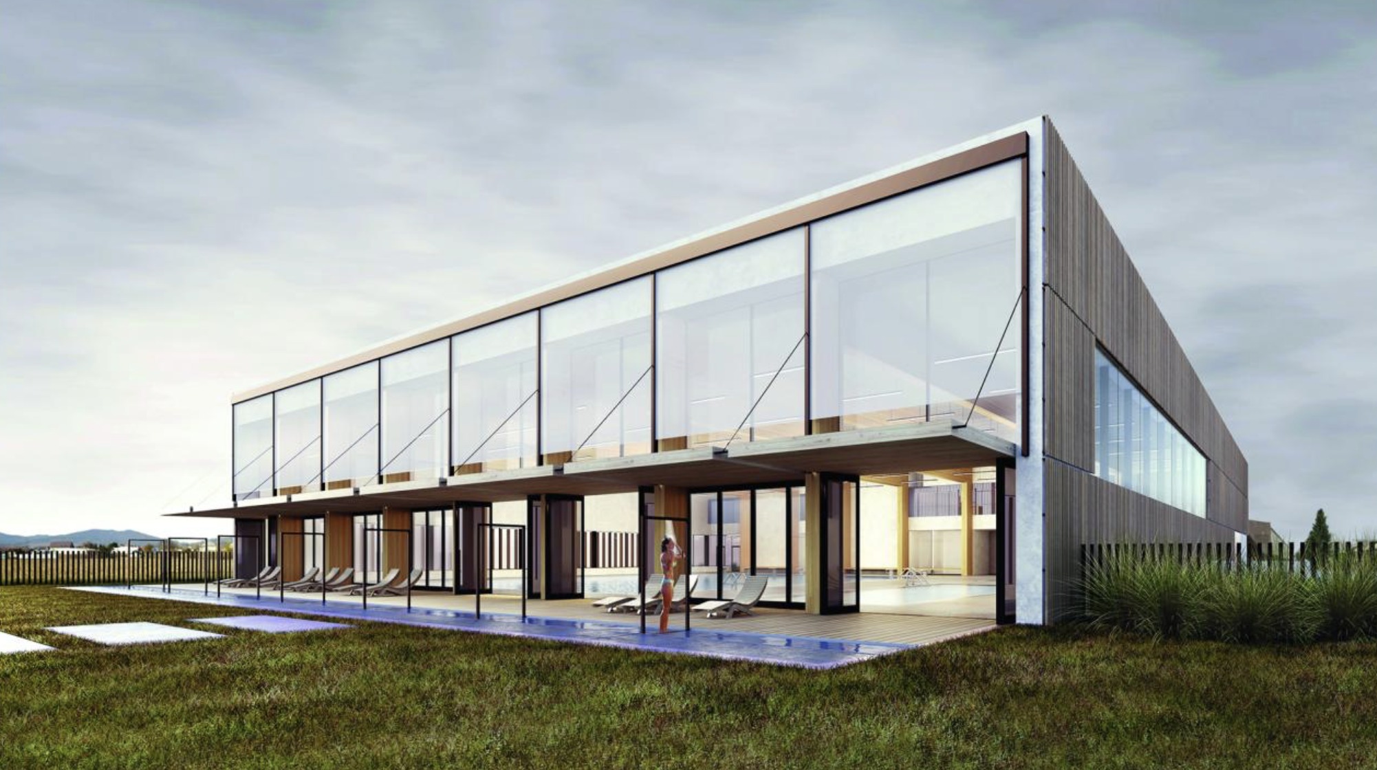 V lete bude možné jednu stenu bazénovej haly úplne otvoriť a halu tak prepojiť s exteriérovou drevenou terasou. 