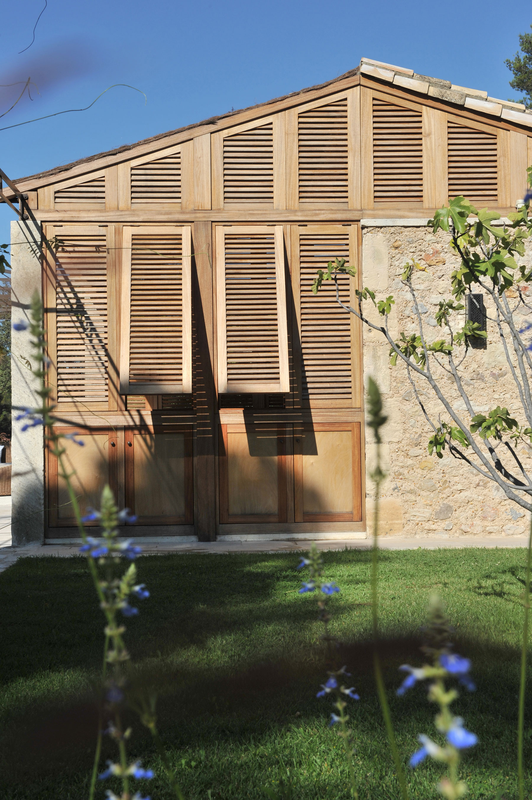 16   The pool house has tropical hardwood shutters